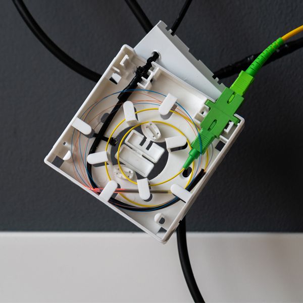 ftb86 optical outlet was fixed on wall with drop cable and 1pc sc apc pigtail and 1pc sc adapter to bring the fiber to home